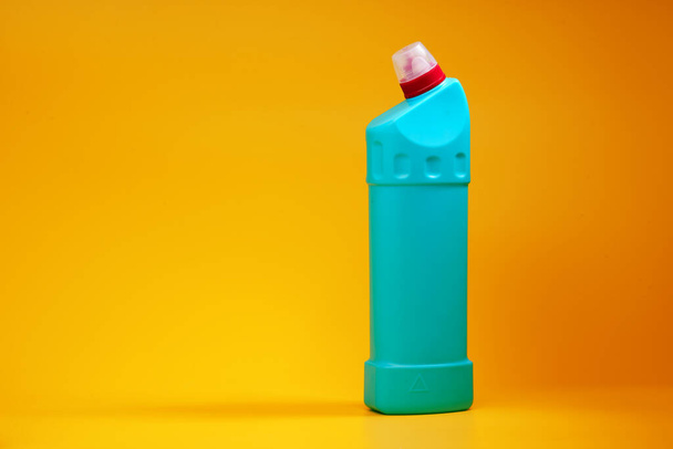 House cleaning detergent bottles on a yellow background - Φωτογραφία, εικόνα
