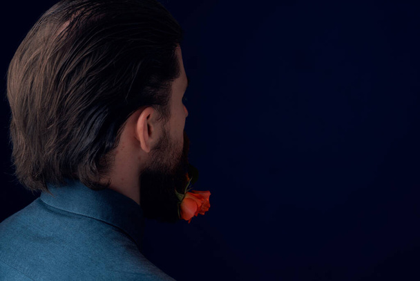 handsome man posing flowers in a beard fashion Lifestyle close-up Studio - Foto, Imagem
