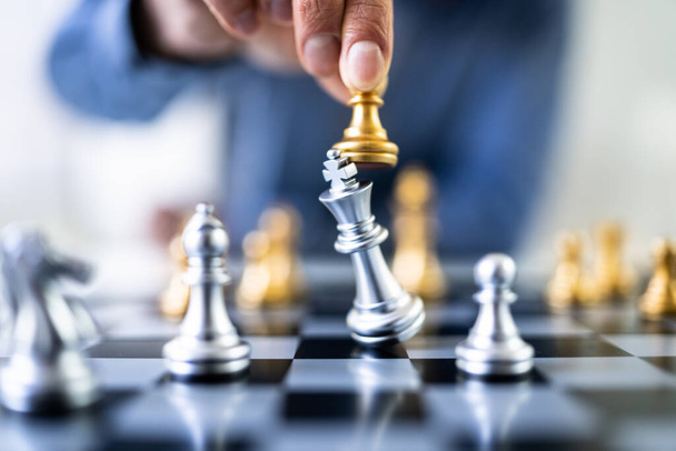 Chess Player Makes A Move To Defeat King Piece - Fotó, kép
