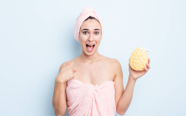 young pretty woman feeling happy and pointing to self with an excited. shower and sponge concept - Zdjęcie, obraz