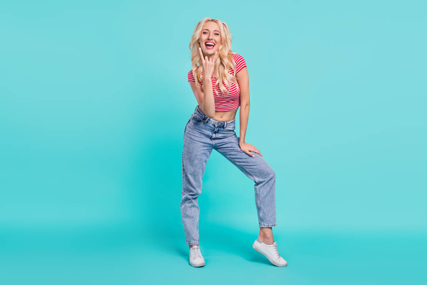 Full body photo of cheerful happy young woman make fingers rock sign face isolated on teal color background. - Φωτογραφία, εικόνα