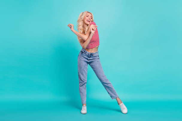 Full body photo of positive young woman good mood funky dance enjoy summer isolated on teal color background. - Photo, Image