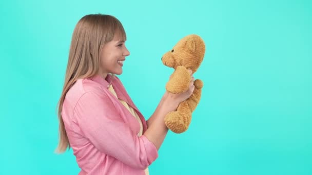 Romantic funny dream lady hold fluffy bear send air kiss - Záběry, video