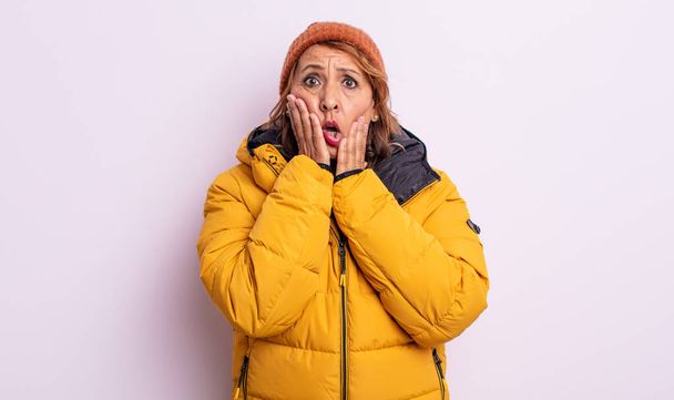 pretty middle age woman feeling shocked and scared. winter concept - Фото, зображення