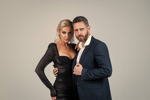 sexy couple in love. man embrace woman. formal couple. confident businessman with lady. business partners success. fashion and beauty. romantic relationship of guy and girl - Fotografie, Obrázek