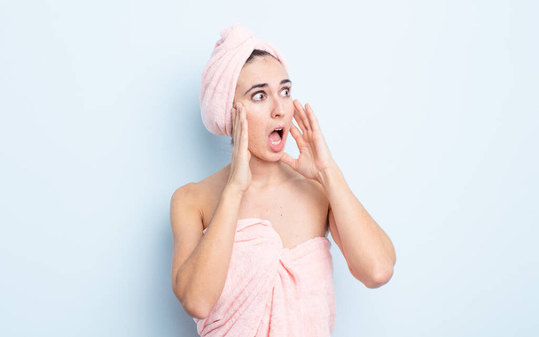 young pretty woman feeling happy, excited and surprised. beauty and shower concept - Foto, Imagen