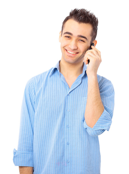 Young casual man talking on the phone isolated on white background - Foto, Bild