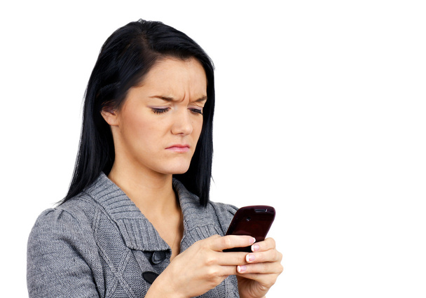Unhappy woman with phone - Zdjęcie, obraz
