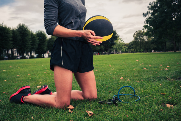 Woman with medicine ball and resistance band - Foto, afbeelding