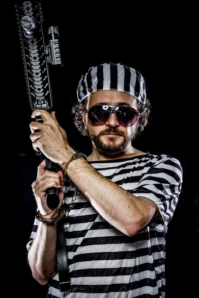 Man holding a machine gun - Fotoğraf, Görsel