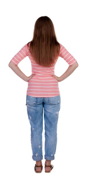 Standing woman in jeans Back view - Fotoğraf, Görsel
