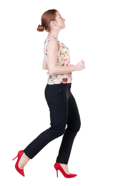 running business woman. back view. going young girl in  suit. Re - Фото, изображение