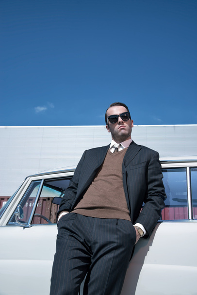 Retro 60s fashion business man wearing grey suit and black sungl - Φωτογραφία, εικόνα