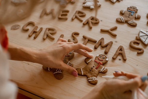 Gingerbread man in the making. Preparing for Christmas. Homemade pastries - 写真・画像