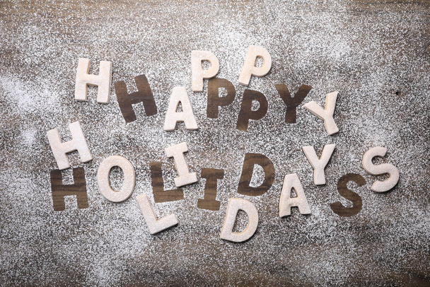 Happy Holidays Written With Cookies on Wooden Background - Φωτογραφία, εικόνα