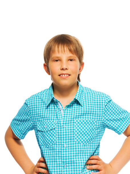 Confident young boy in blue shirt - 写真・画像