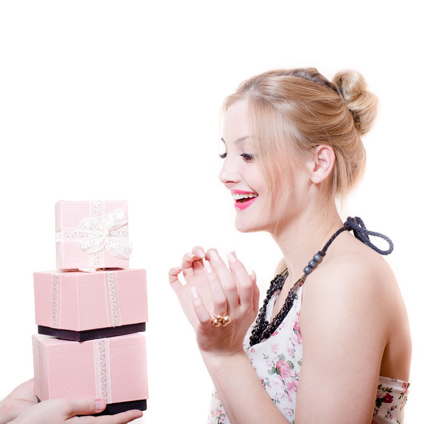 Picture of receiving gifts or presents surprised attractive blond young woman elegant female having fun happy smiling isolated on white background portrait - Photo, Image