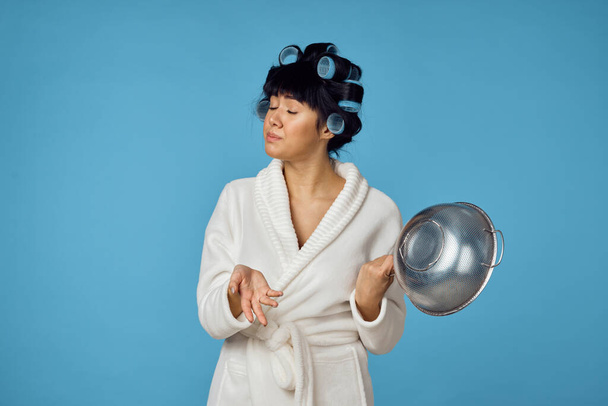 housewife in white coat housework cleaning blue background - Zdjęcie, obraz