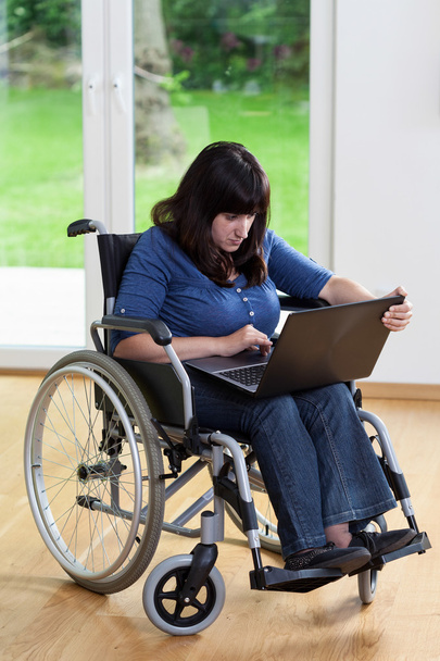 Disabled woman using laptop - Photo, Image