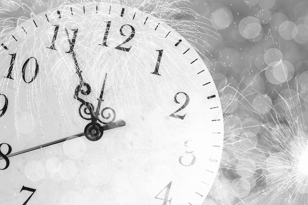 Clock with bokeh lights and firework - Photo, Image