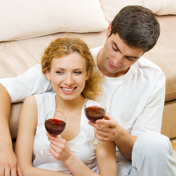 Cheerful couple with glasses of redwine - Fotoğraf, Görsel