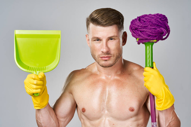 man with pumped body mop cleaning housework - Foto, Bild