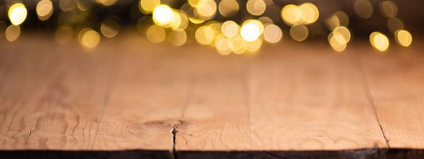empty wooden table top with blurred light gold bokeh abstract background. For montage product display or design key visual layout - Foto, Bild