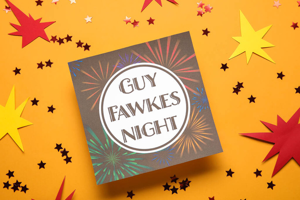 Carte de voeux pour Guy Fawkes nuit et confettis sur fond orange, gros plan - Photo, image