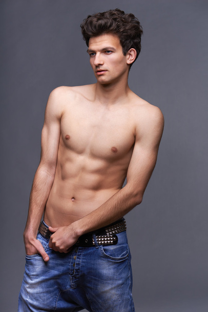 Male fashion model with modern haircut - Valokuva, kuva