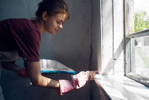 woman painter paint window home interior renovation - Фото, зображення