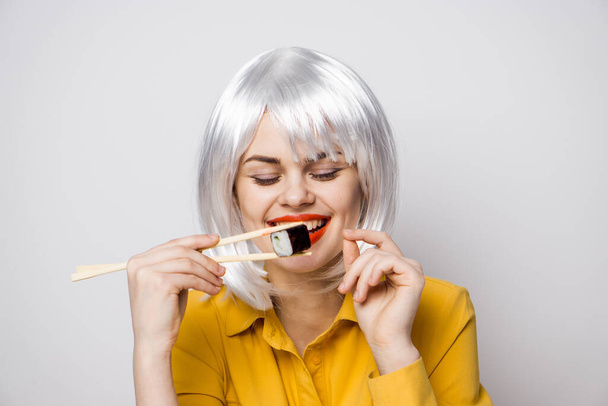 pretty woman with white hair sushi asian food - Foto, Imagen