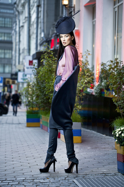Young beautiful model in a stylish designer clothes - 写真・画像