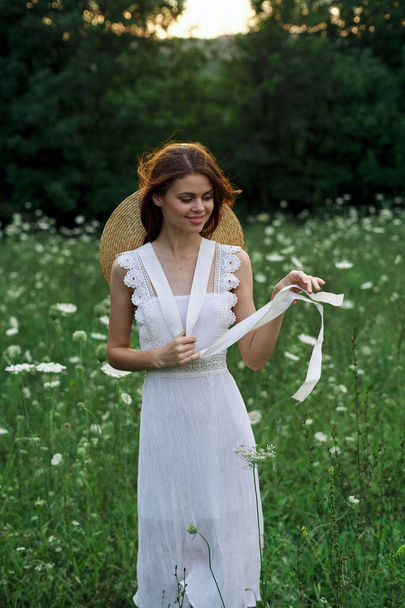 Woman in white dress flowers nature walk charm - Fotoğraf, Görsel