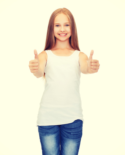 girl in blank white shirt showing thumbs up - Zdjęcie, obraz