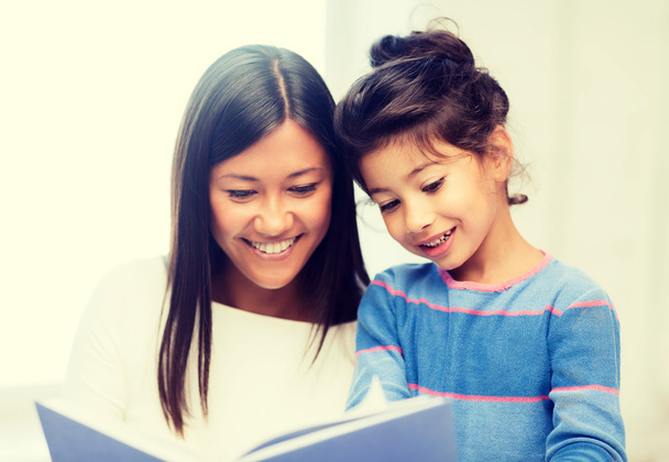 mother and daughter with book - Photo, Image