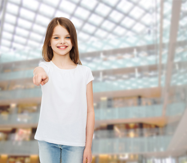 smiling little girl in white blank t-shirt - Фото, изображение