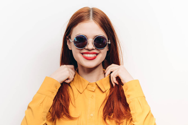 cheerful attractive woman in yellow shirt fashionable clothes sunglasses - Fotó, kép