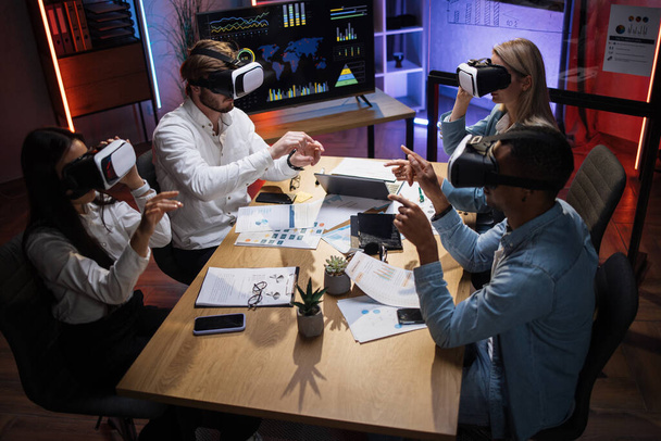 Diverse company workers using VR headset during conference - Fotografie, Obrázek