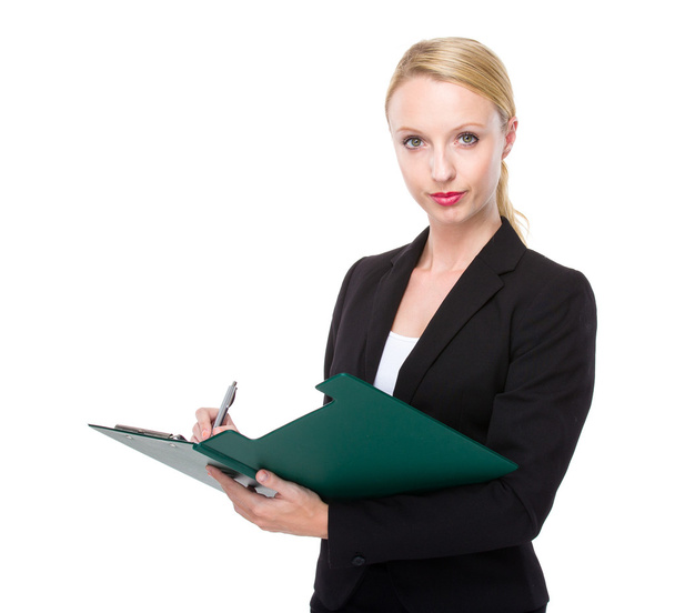 Businesswoman write on clipboard - Фото, изображение
