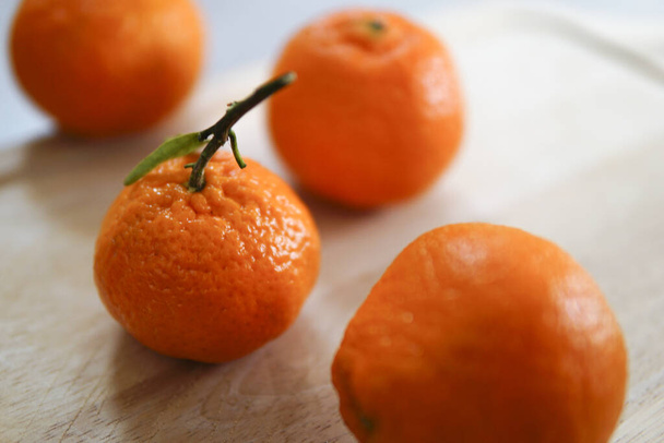 A Closeup of tangerines on a white background - 写真・画像