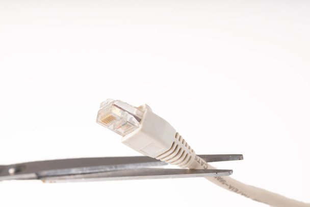 A closeup shot of scissors cutting off internet connection - no internet concept - Fotografie, Obrázek
