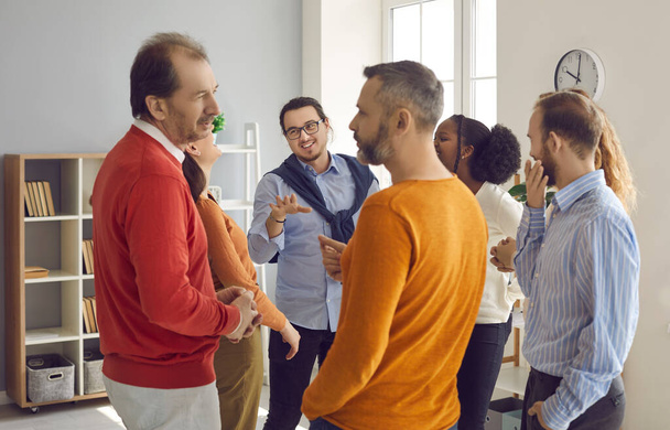 Groups of different people standing randomly and talking on business meeting - Фото, зображення