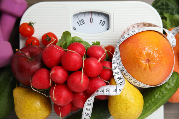 Fresh healthy food on scales, top view - Photo, Image