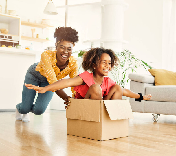 child family mother fun happy girl happiness daughter box together relocation moving cardboard box - Foto, afbeelding