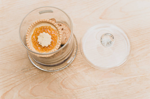 organic sweet biscuits and pastries in a glass jar on a rustic wooden tabletop with text space - Photo, image