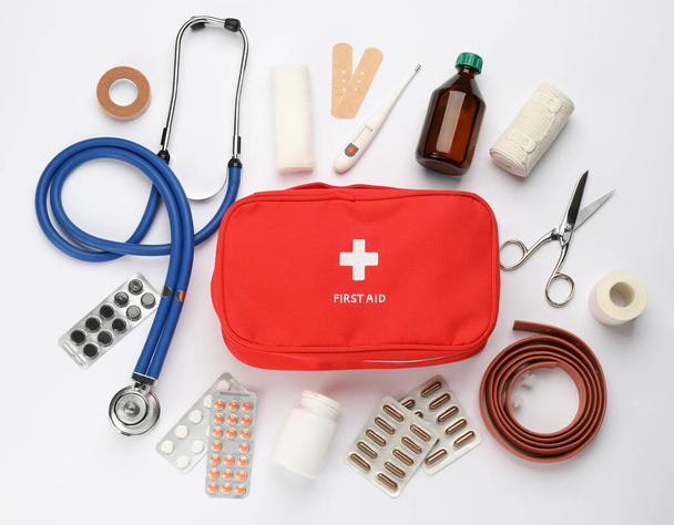 Flat lay composition with first aid kit on white background - Φωτογραφία, εικόνα