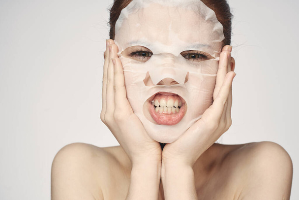 woman in cosmetic mask facial skin care rejuvenation - Photo, Image