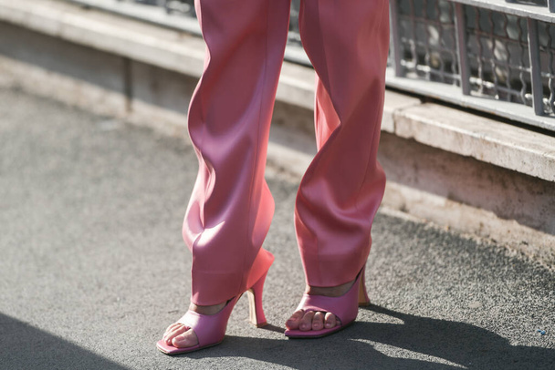 Milan, Italy - September 22, 2021: detail pf pink pants and shiny shoes. - Photo, Image