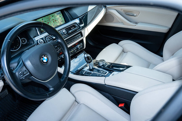 CLUJ, ROMANIA - Jun 30, 2021: A white leather upholstery interior BMW 520d sedan year 2014 - Fotografie, Obrázek