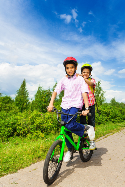 Two happy boys riding bike - Foto, Imagen